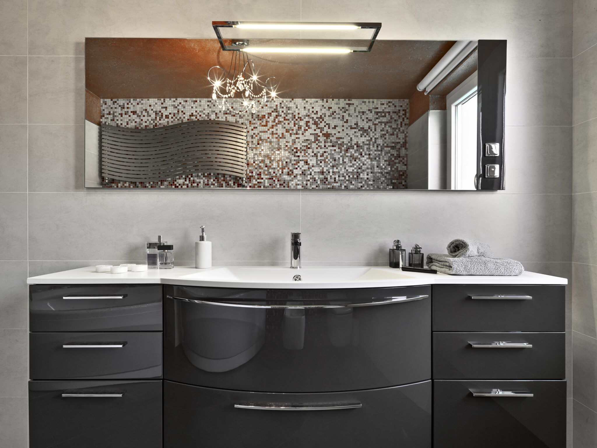 Designed and mounted by Groves Glass for a modern, balanced finish.