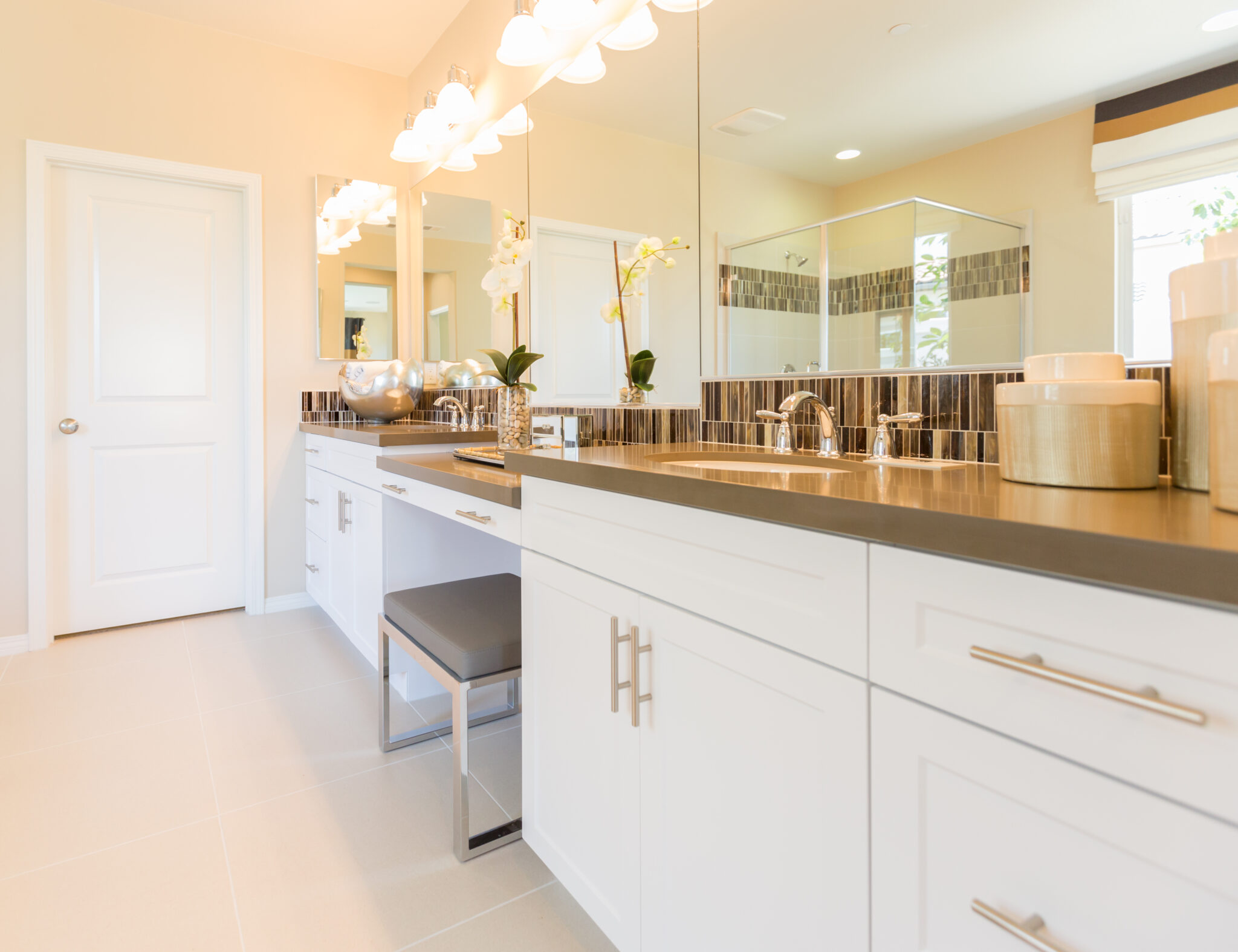 Custom bathroom mirror installation with dual sinks and glass shower in Port Hadlock WA home